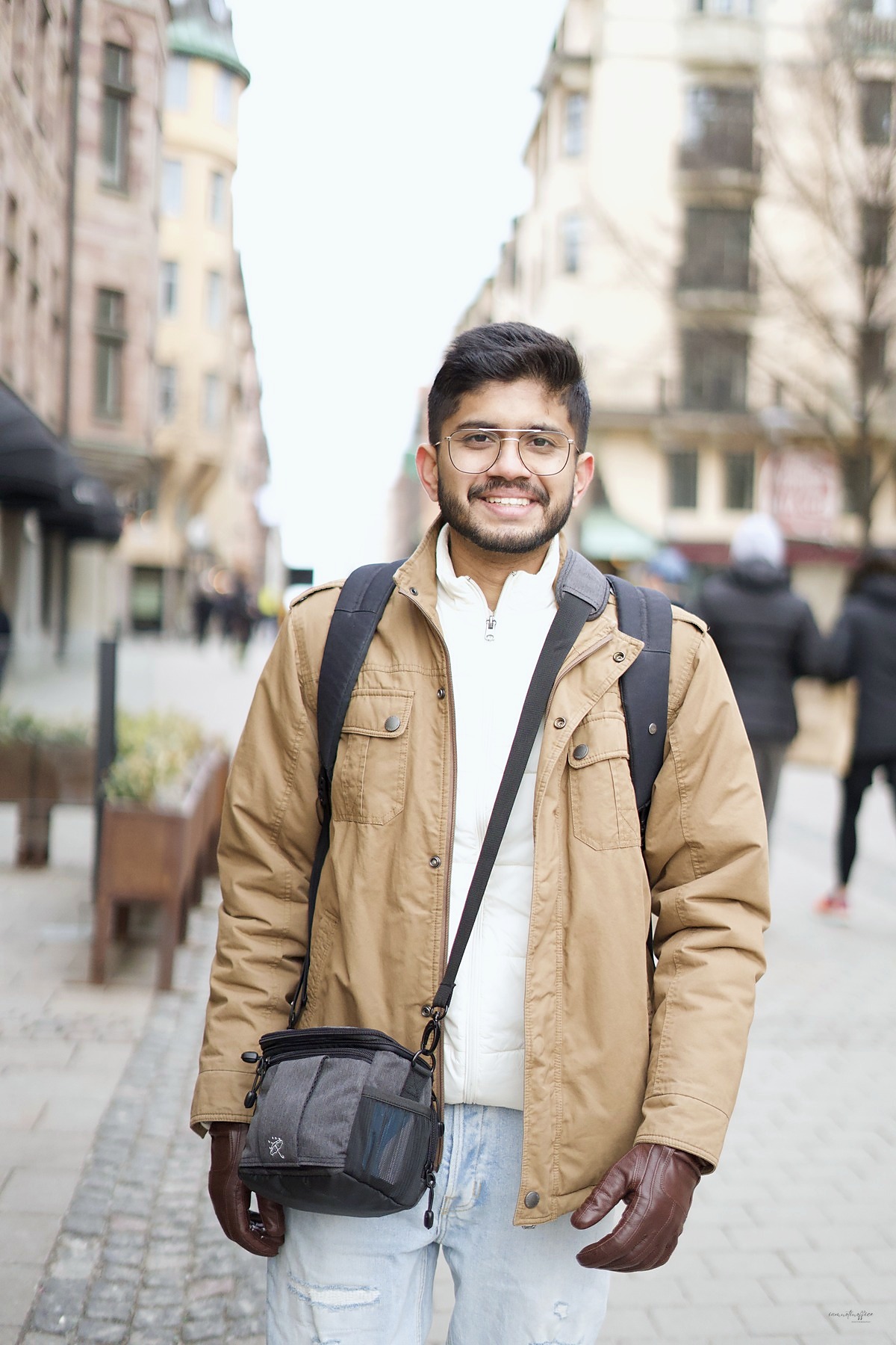 Akshay Gokarnakar smiling on a street in Stockholm